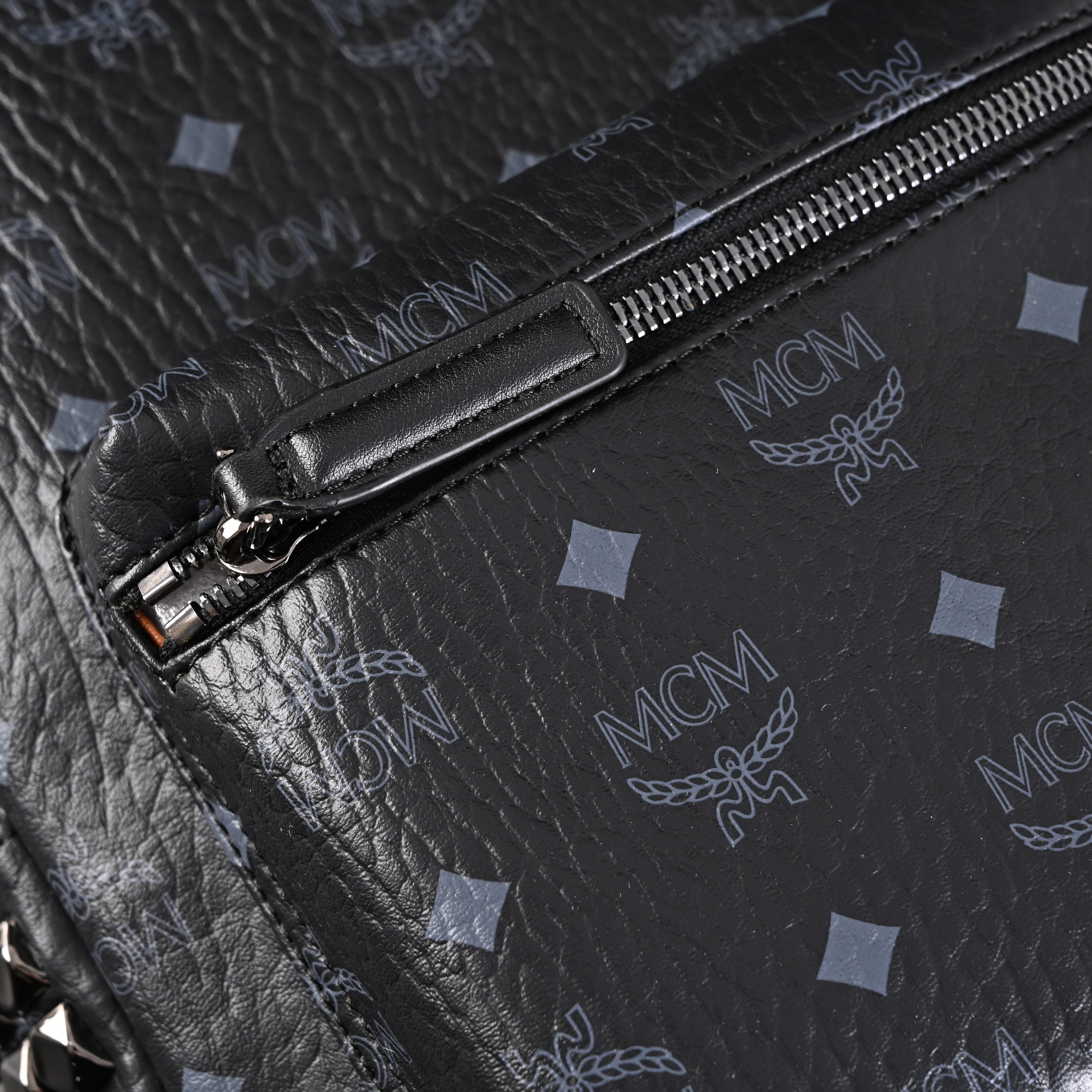 MCM Stark Visetos Medium Backpack – Black Monogram with Studded Detailing